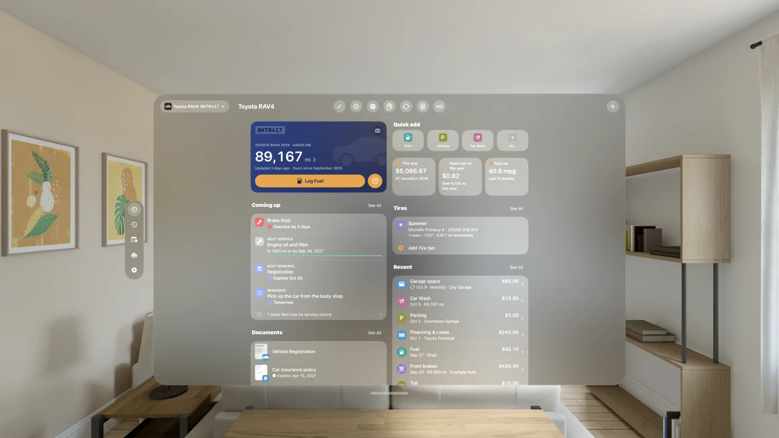 CarStamp on Apple Vision Pro: the car's Overview in a window in the room, with the odometer, quick add, this year's spending and spent per mile, what is coming up and tires.